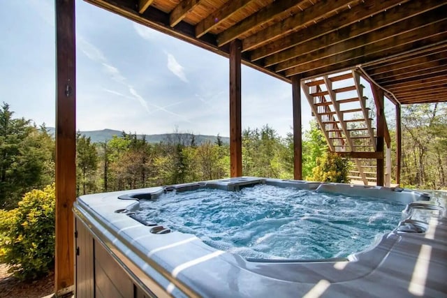 exterior space with a hot tub