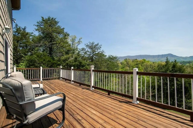 wooden terrace featuring a mountain view