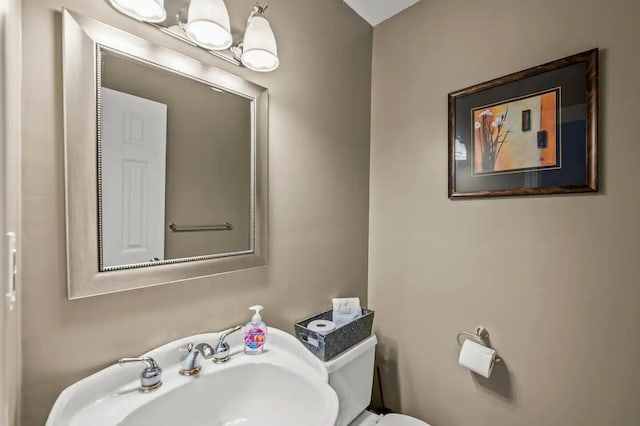 bathroom with sink and toilet