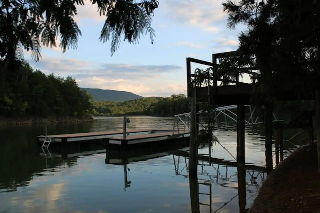 dock area with a water and mountain view