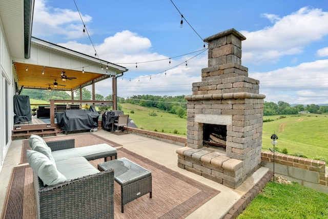 view of patio / terrace with an outdoor living space with a fireplace, area for grilling, and a ceiling fan