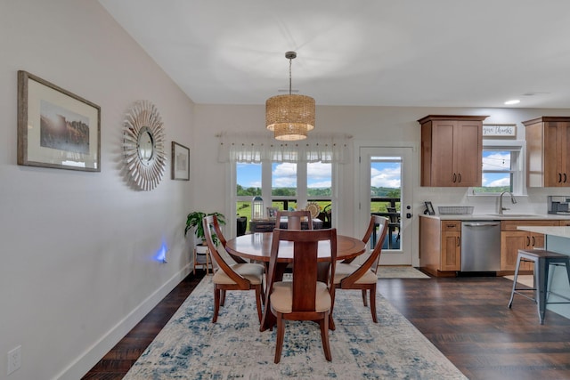 dining area with healthy amount of natural light, a chandelier, baseboards, dark wood finished floors, and recessed lighting