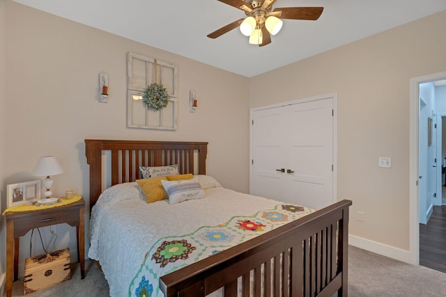 carpeted bedroom featuring baseboards and ceiling fan