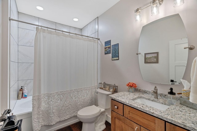 bathroom with shower / bathtub combination with curtain, toilet, wood finished floors, and vanity