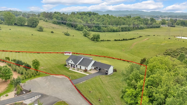 overview of rural landscape featuring property parcel outlined, a pastoral area, and a mountain backdrop