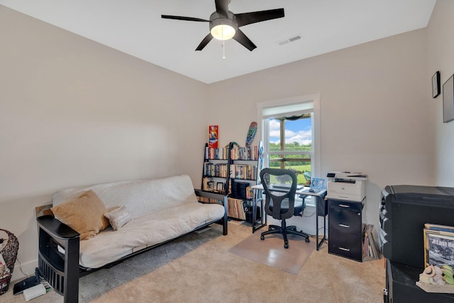office space with carpet and a ceiling fan