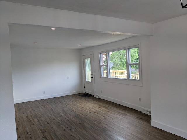 interior space with visible vents, dark wood-style flooring, baseboards, and recessed lighting
