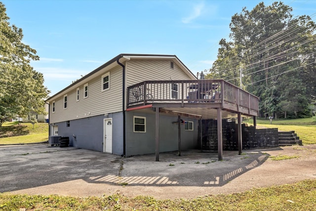 1651 Old Liberty Hill Rd, Morristown, TN 37814 - back of house with a wooden deck, cooling unit, and a patio area