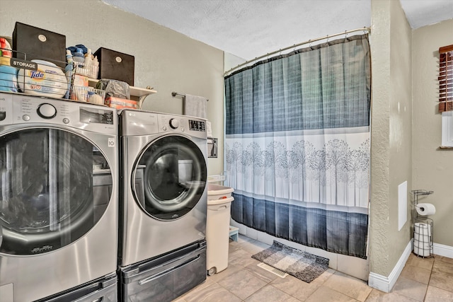 1651 Old Liberty Hill Rd, Morristown, TN 37814 - washroom with washer and dryer, a textured ceiling, and baseboards