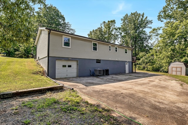 1651 Old Liberty Hill Rd, Morristown, TN 37814 - view of side of property with driveway, central air condition unit, a lawn, and a garage