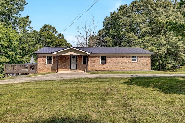 1651 Old Liberty Hill Rd, Morristown, TN 37814 - view of front of house with a front lawn, a wooden deck, metal roof, and brick siding
