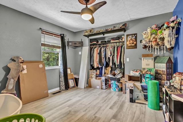 1651 Old Liberty Hill Rd, Morristown, TN 37814 - bedroom with a textured ceiling, wood finished floors, a closet, and ceiling fan