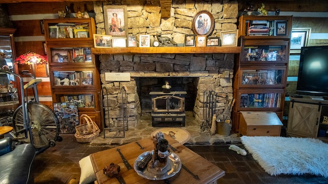 living room featuring a stone fireplace