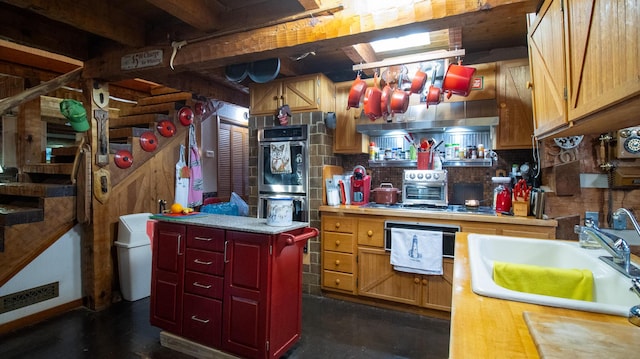 kitchen with a center island, stainless steel appliances, and sink