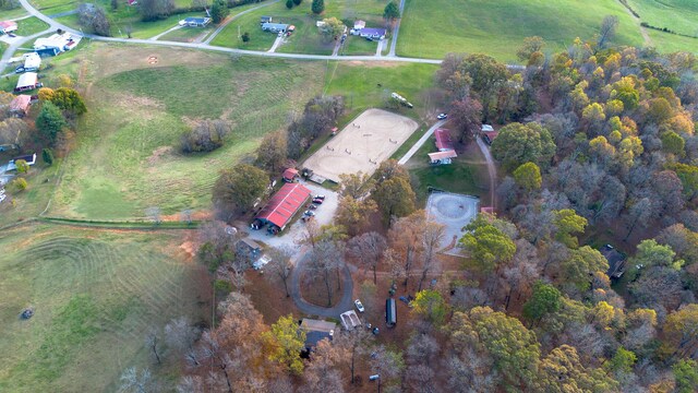 birds eye view of property with a rural view