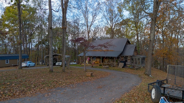 log-style house featuring covered porch