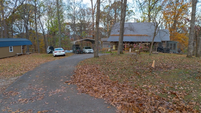 view of front of home with a carport