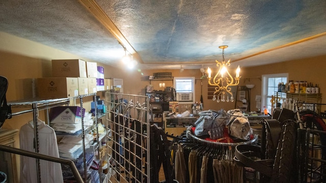 interior space featuring cooling unit, a textured ceiling, and an inviting chandelier