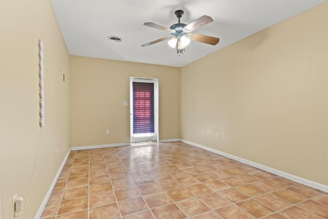 unfurnished room featuring a ceiling fan, baseboards, and visible vents