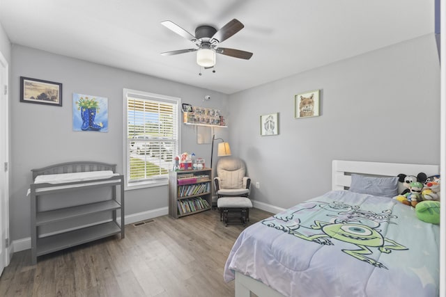 411 Mckinney Dr, Sevierville, TN 37876 - bedroom featuring baseboards, visible vents, a ceiling fan, and wood finished floors