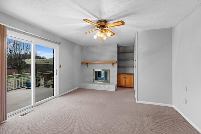 unfurnished living room featuring carpet floors, baseboards, and a brick fireplace