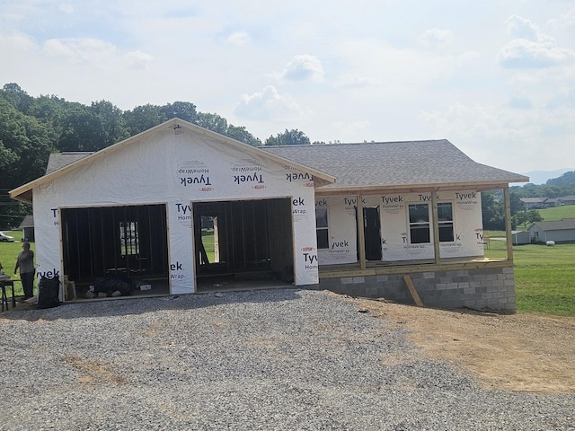 289 Scenic Dr, Newport, TN 37821 - property under construction with a garage, gravel driveway, roof with shingles, and a porch