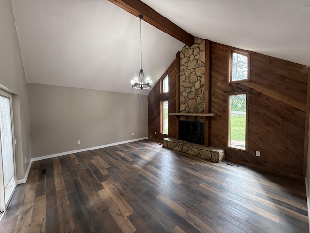 2157 Windy Cove Ln, Talbott, TN 37877 - unfurnished living room featuring a chandelier, dark wood finished floors, wooden walls, beam ceiling, and a fireplace