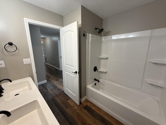 2157 Windy Cove Ln, Talbott, TN 37877 - bathroom featuring wood finished floors, bathtub / shower combination, and a textured ceiling