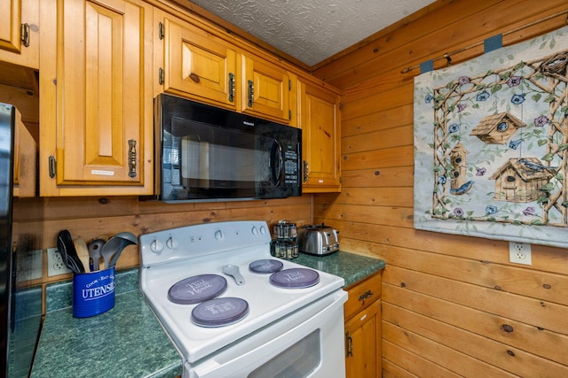kitchen with white electric range, wooden walls, and a textured ceiling