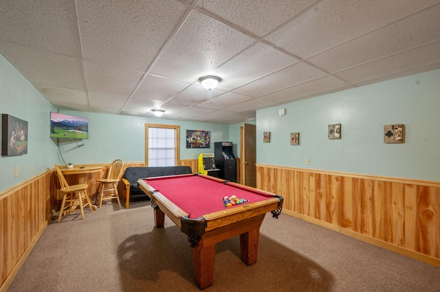 rec room featuring a paneled ceiling, wooden walls, carpet floors, and pool table