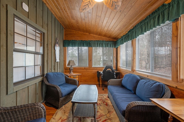 sunroom featuring lofted ceiling, wood ceiling, and ceiling fan