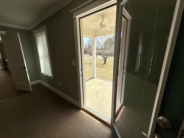 doorway to outside featuring dark wood-style floors and baseboards