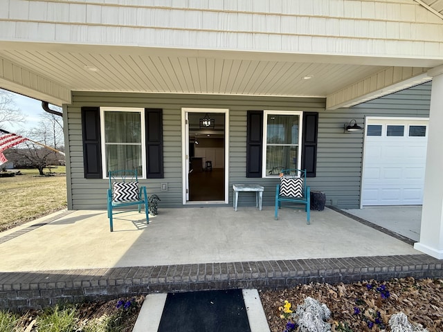 view of exterior entry featuring a porch