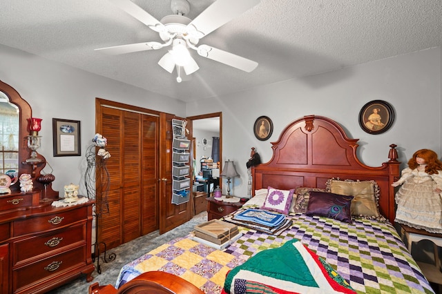 carpeted bedroom with a closet, a textured ceiling, and ceiling fan