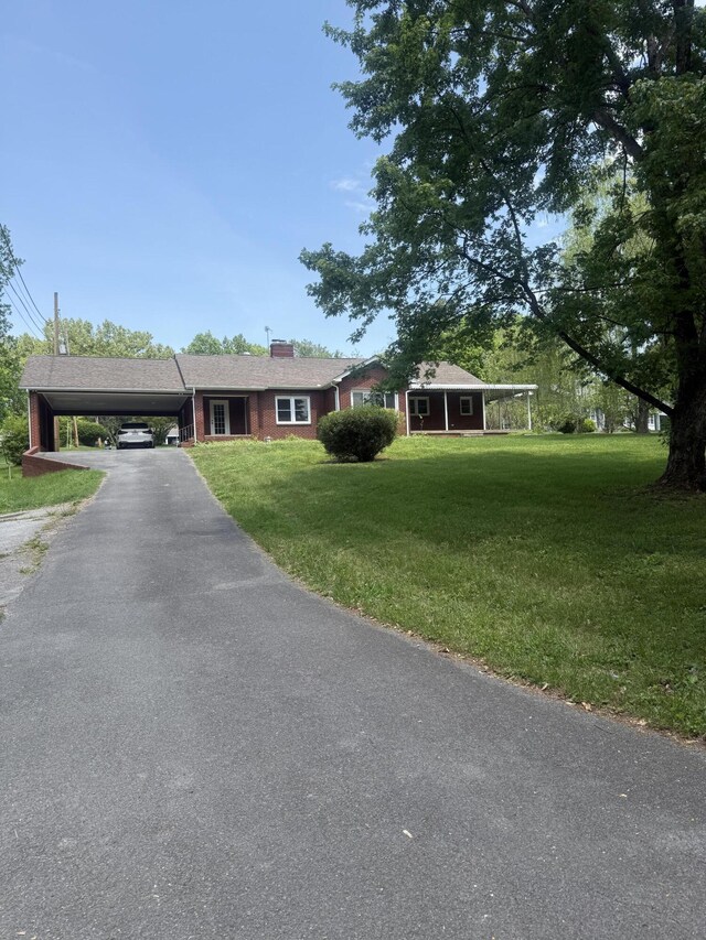 240 Clifton Heights Rd, Newport, TN 37821 - single story home featuring an attached carport, driveway, and a front yard