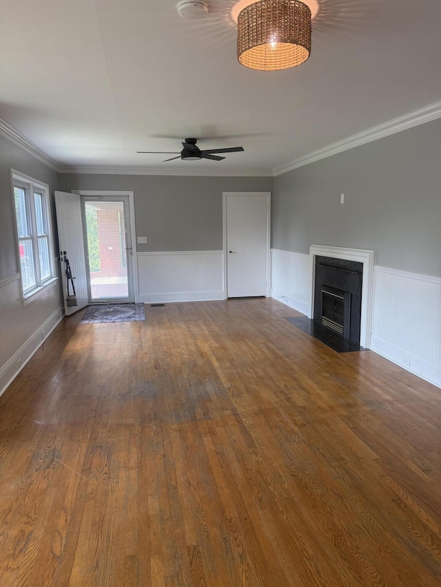 240 Clifton Heights Rd, Newport, TN 37821 - unfurnished living room with crown molding, a wainscoted wall, and wood finished floors