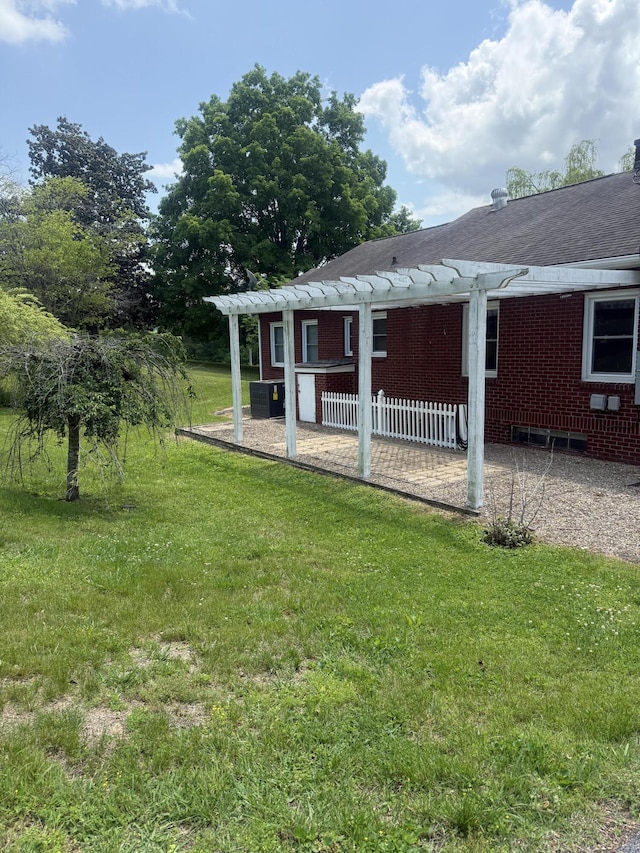 240 Clifton Heights Rd, Newport, TN 37821 - exterior space with brick siding, central AC unit, a yard, and a shingled roof