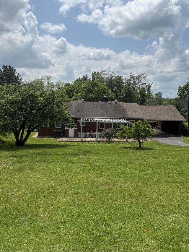 240 Clifton Heights Rd, Newport, TN 37821 - view of front facade featuring aphalt driveway, a carport, and a front lawn