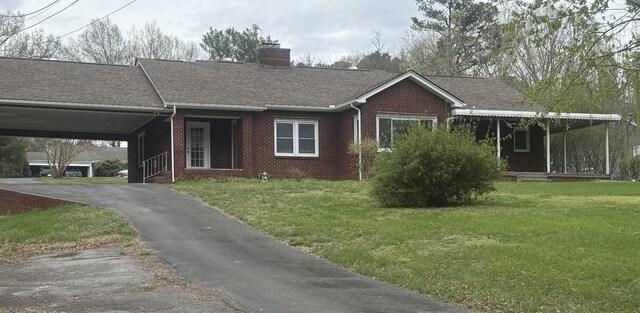 240 Clifton Heights Rd, Newport, TN 37821 - ranch-style house with brick siding, aphalt driveway, a chimney, and a front lawn