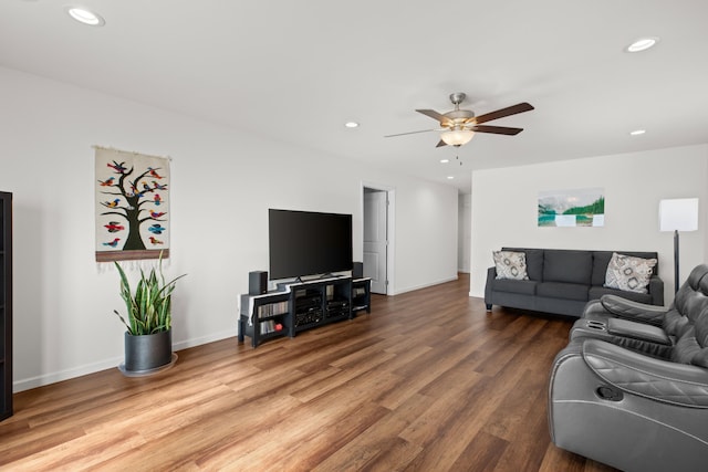 living room featuring recessed lighting, ceiling fan, baseboards, and wood finished floors