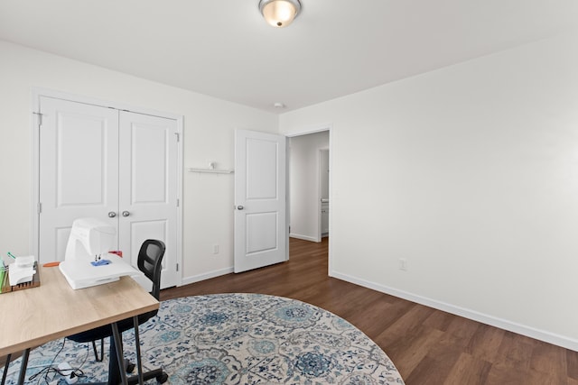 home office featuring dark wood-style flooring and baseboards