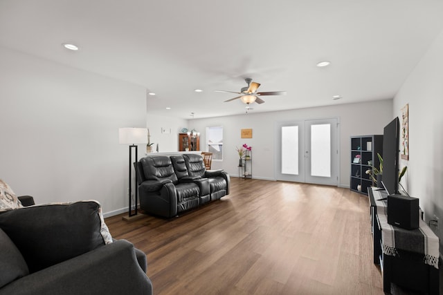 living room featuring recessed lighting, baseboards, wood finished floors, and french doors