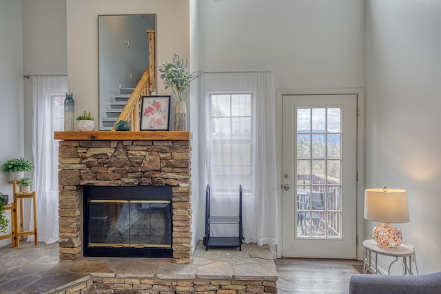 entryway featuring a fireplace and wood finished floors