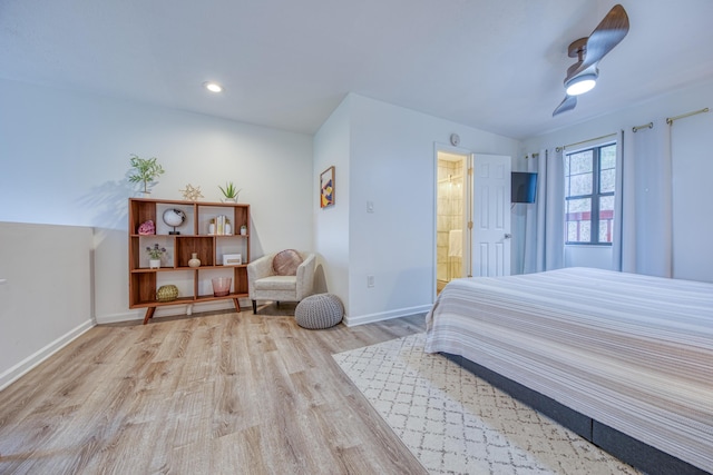 bedroom featuring wood finished floors, baseboards, recessed lighting, ceiling fan, and connected bathroom