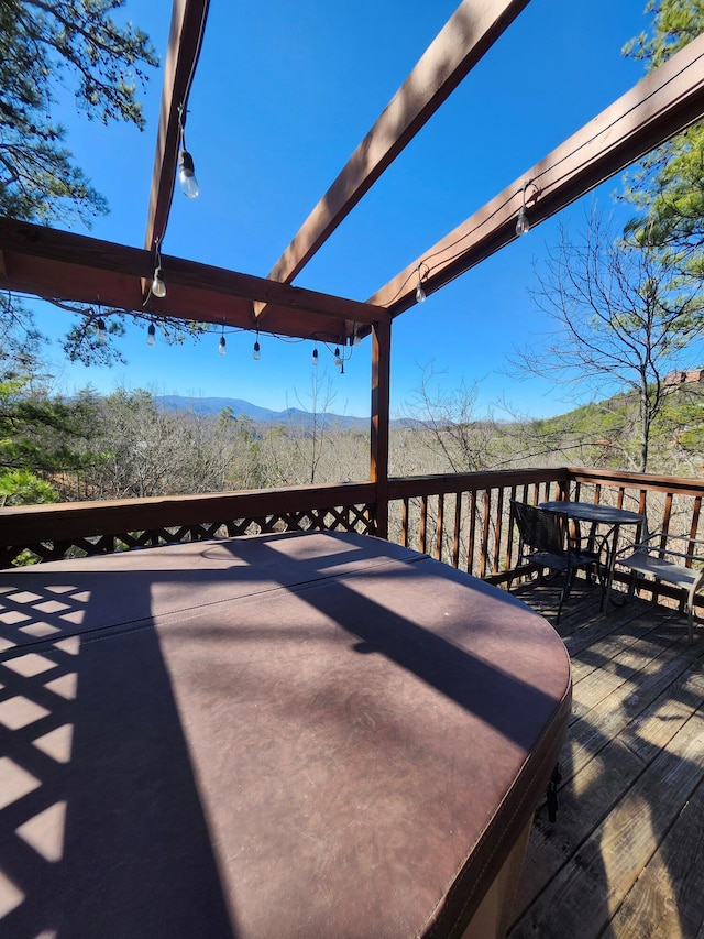 wooden terrace with outdoor dining area