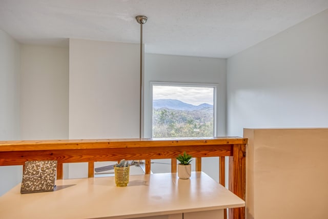 unfurnished dining area featuring a mountain view