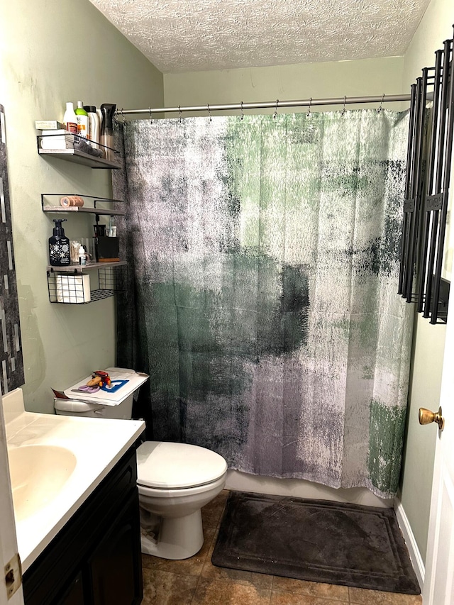 full bathroom with vanity, shower / bath combo, toilet, and a textured ceiling