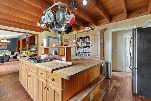 kitchen featuring a notable chandelier, wooden counters, appliances with stainless steel finishes, open shelves, and dark wood finished floors