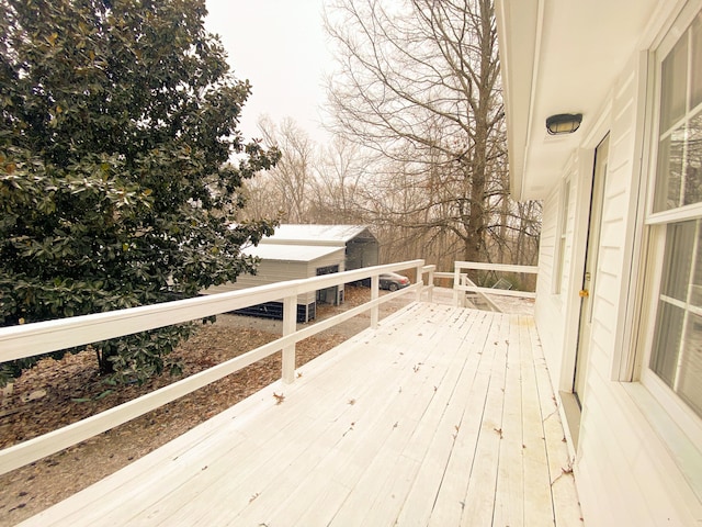 wooden terrace with an outdoor structure