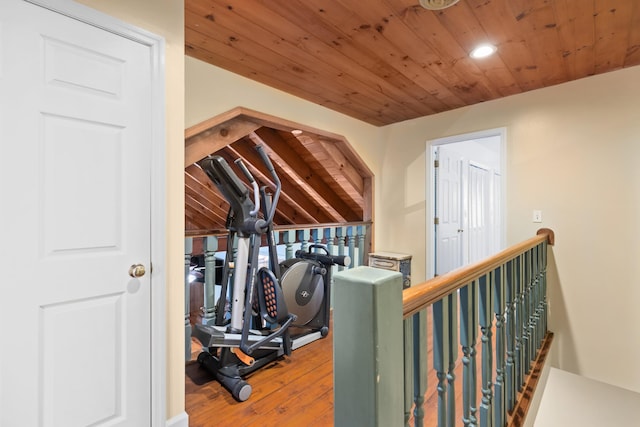 exercise area with recessed lighting, wooden ceiling, and hardwood / wood-style flooring